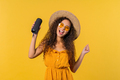 Summer woman dancing, enjoying on yellow background. She moves to music rhythm - PhotoDune Item for Sale