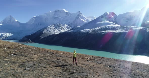 Woman trail runner cross country running in winter nature,Drone  aerial view footage,slow motion