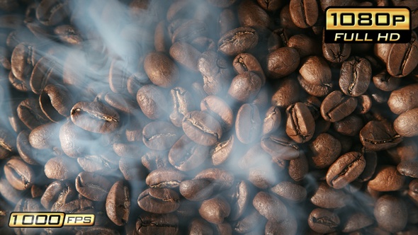 Birds Eye View of Smoking Rotating Coffee Beans