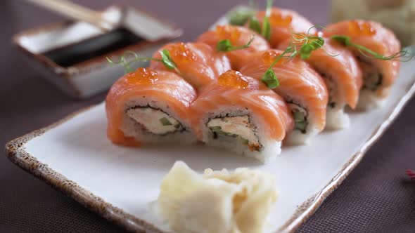 Sushi set with salmon and red caviar, beautifully presented on the table