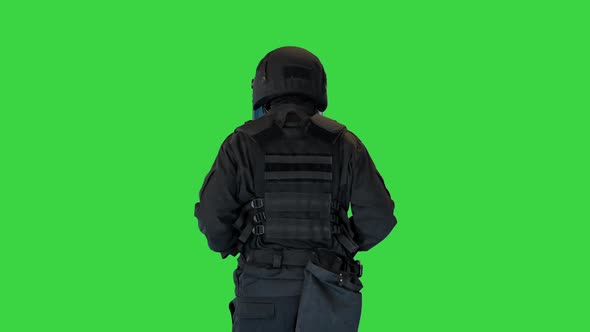 Riot Policeman in a Helmet Jogging on a Green Screen Chroma Key