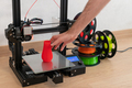 Modern 3D printer and multi-colored filament spools - PhotoDune Item for Sale