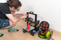 Modern 3D printer and multi-colored filament spools - PhotoDune Item for Sale