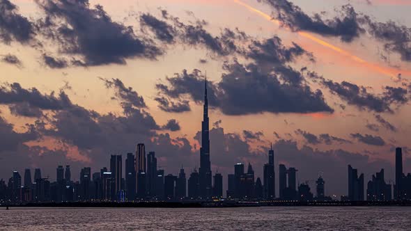 View of Burj Khalifa Skyline From the Dubai Creek Harbour Sunset Timelapse.