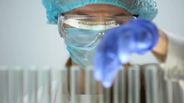 Medical Lab Worker Marking Tube With Urine Sample, Checking Bilirubin Level