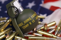 M67 frag grenade and many yellow bullets and cartridges on United States flag - PhotoDune Item for Sale