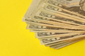 Big amount of old twenty dollar bills on yellow background - PhotoDune Item for Sale