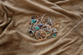 Bunch of stolen jewelry on military uniform cloth fabric - PhotoDune Item for Sale
