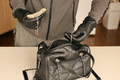 Robber in black outfit and gloves see in opened stolen women bag - PhotoDune Item for Sale