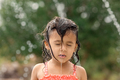 Little toddler girl standing with wet hair at playground in the summer - PhotoDune Item for Sale