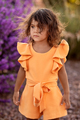 Adorable toddler girl with blooming flowers as a background at spring day outdoor - PhotoDune Item for Sale