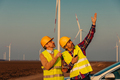 Engineers working on the field at a wind turbine field - PhotoDune Item for Sale