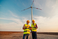 Wind Turbine middle age mechanical engineers working outdoors - PhotoDune Item for Sale