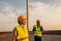 Two workers on a wind turbines farm. - PhotoDune Item for Sale