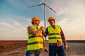 Teamwork at field with windmill - PhotoDune Item for Sale
