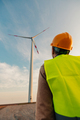 Engineer standing in field with wind turbines - PhotoDune Item for Sale
