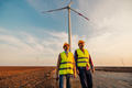 Engineers working on the field at a wind turbine - PhotoDune Item for Sale
