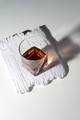 Glass of elegant whiskey on white stone - PhotoDune Item for Sale