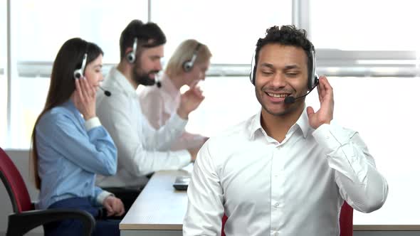 Cheerful Indian Call Center Worker Showing Thumb Up.