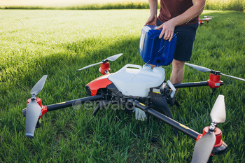 iot smart agriculture industry concept, drone in precision farm use for spray a water