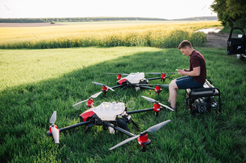 smart agriculture industry concept, drone in precision farm use for spray a water.