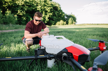 iot smart agriculture industry concept, drone in precision farm use for spray a water