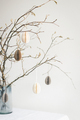 Tablescaping with Easter paper eggs hanging on branches. - PhotoDune Item for Sale