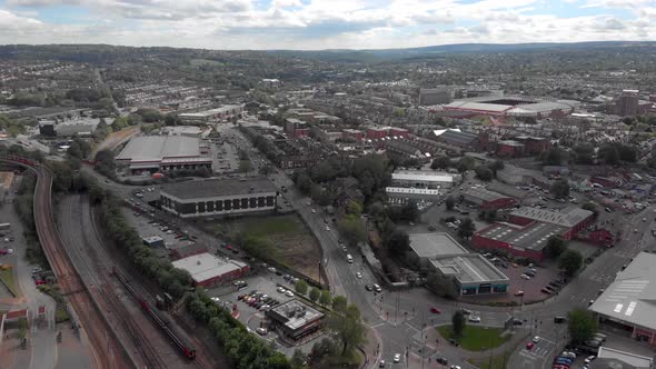 Drone flying above Sheffield City Summer Sunny Day 4K Train Station train tracks Vivid Traffic and T