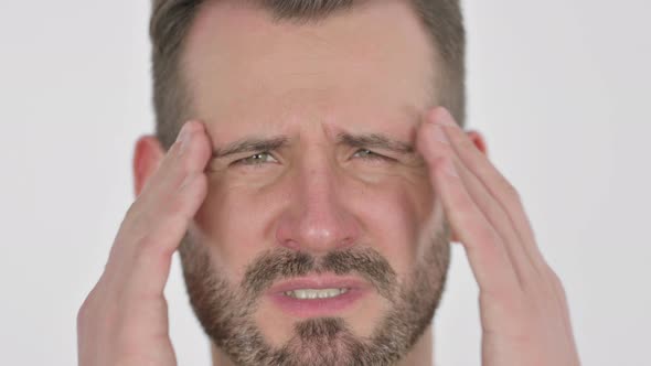 Close Up of Face of Middle Aged Man Having Headache