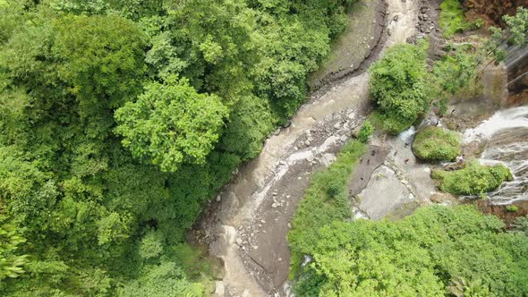 Aerial view of the river and streams in mountain gorge tropical forest.