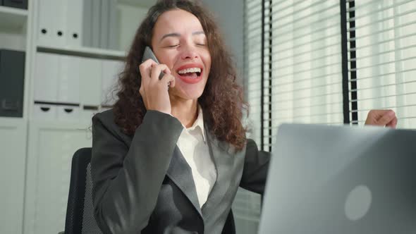 Latino beautiful businesswoman in formal wear use laptop work in office.