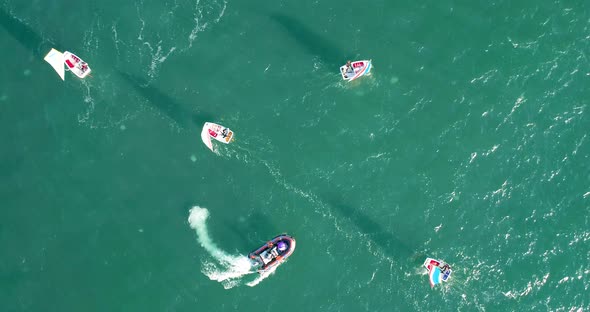 Aerial view of sailing boats navigating near Acre Old City port in Israel.