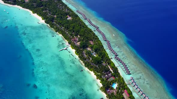 Aerial drone sky of island beach voyage by blue water with sand background