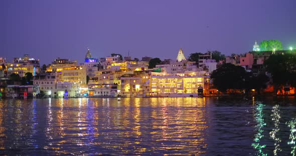 Lal Ghat: Udaipur Haveli, Houses and Ghats on Bank of Lake Pichola with Water Riffles. Rajput