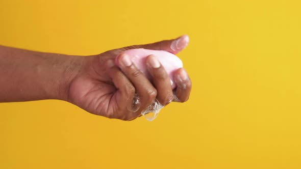 Young Man Washing Hands with Soap Warm Water