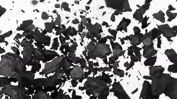 Super Slow Motion Shot of Coal Explosion Isolated on White Background at 1000 Fps