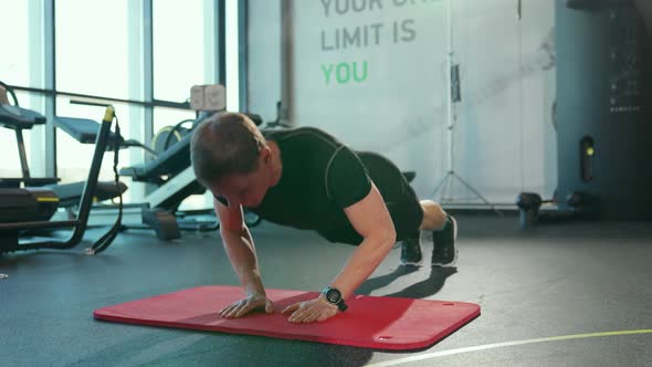 Selfimprovement Athletic Man Performs Explosive Push Ups in the Gym Videos for Online Training Slow