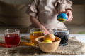 girl at home in the kitchen dyes eggs for Easter - PhotoDune Item for Sale