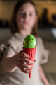 girl holding an Easter egg in a colored ice cream cone - PhotoDune Item for Sale