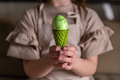 girl holding an Easter egg in a colored ice cream cone - PhotoDune Item for Sale