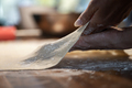 Low angle close up view of female hands stretching and pulling delicate thin homemade pastry dough - PhotoDune Item for Sale