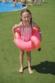 Hooligan girl came out of pool with an circle- flamingo and shows tongue - PhotoDune Item for Sale