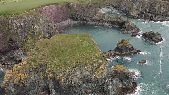 Drone shot of a unique looking rock formation on the Irish coast line.