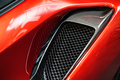 detail of sport car with red metal hood and black air flow intake ornament - PhotoDune Item for Sale