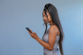 Portrait of young woman using her cellphone - PhotoDune Item for Sale