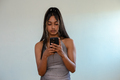 Portrait of young woman seen using her cellphone - PhotoDune Item for Sale