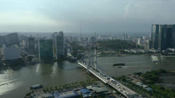 Saigon river waterfront with long afternoon shadows from the  Ho Chi Minh City skyline, a symbol of