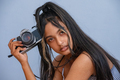 Portrait of young woman with camere in hand - PhotoDune Item for Sale
