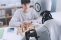 Chess challenge: boy and robot face to face - PhotoDune Item for Sale
