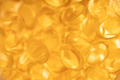 Blurred background with fish oil capsules. - PhotoDune Item for Sale